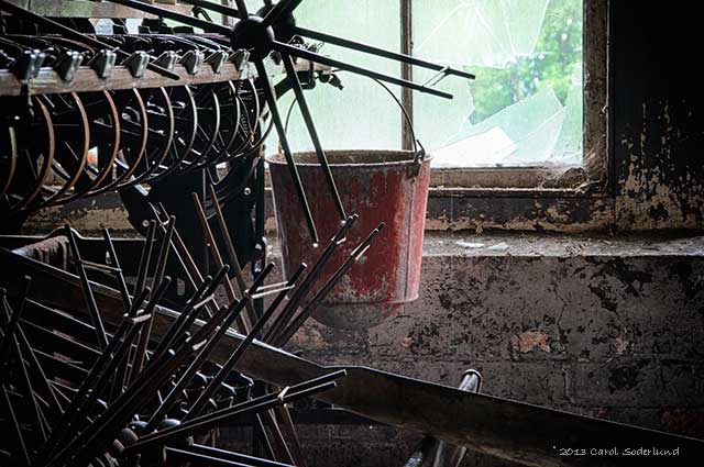 an old fire bucket, now used to catch rain